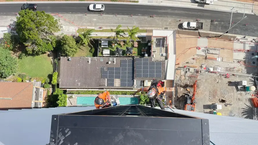 High-rise façade assessed from above before rope access begins